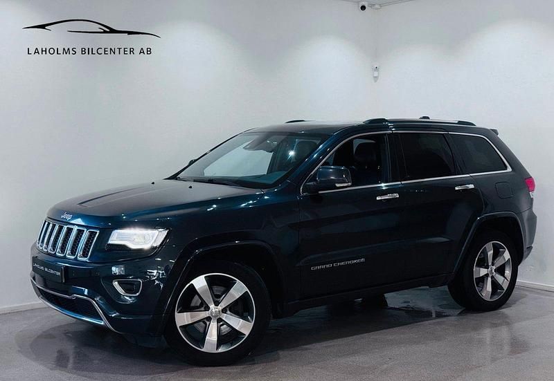 Blå Begagnad 2014 Jeep Grand Cherokee SUV | 164 900 kr (Marknadspris) - Bild 1/4