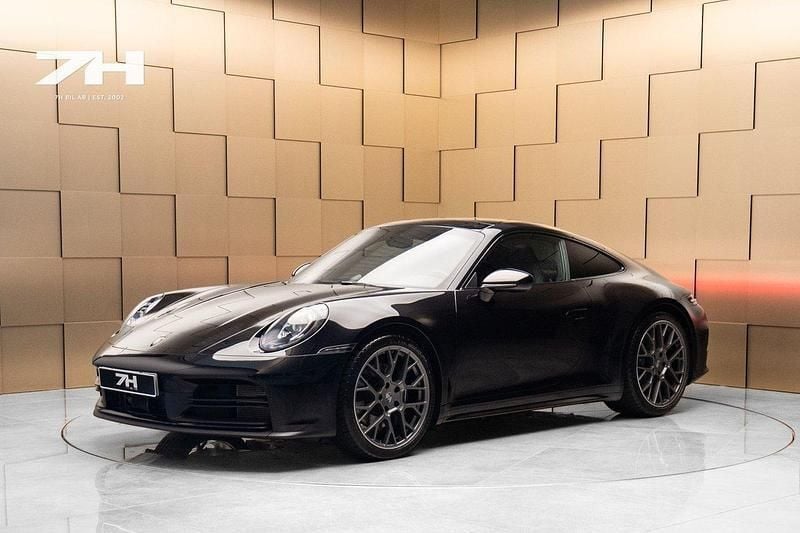 Svart Begagnad 2024 Porsche 911 Carrera Sportkupé | 1 549 000 kr (Dyr) - Bild 1/4