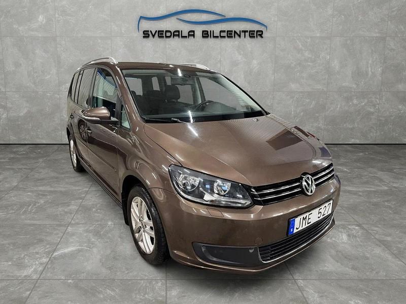 Brun Begagnad 2011 VW Touran Minibuss | 79 898 kr (Marknadspris) - Bild 1/4