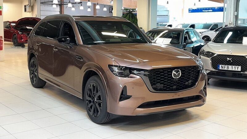 Brun (melting copper metallic) Ny 2025 Mazda CX-80 Homura-Line SUV | 637 000 kr (Marknadspris) - Bild 1/4