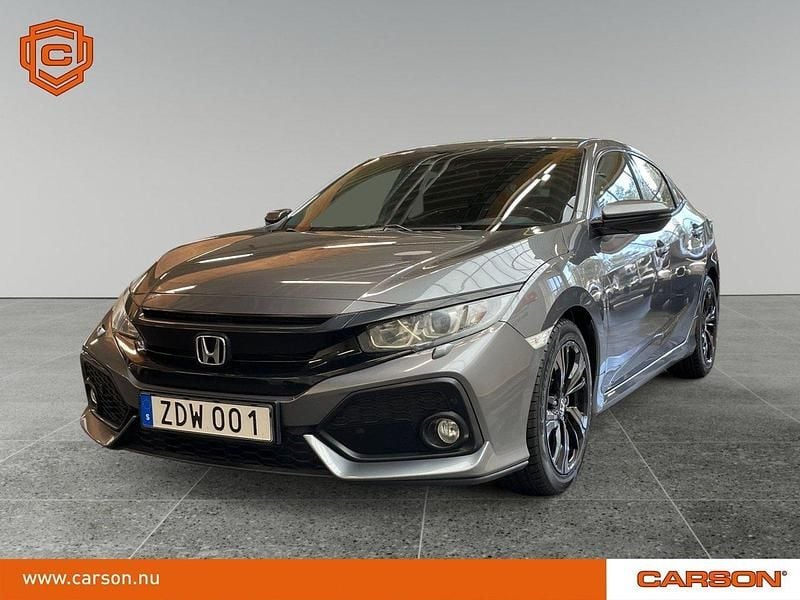 Mörkgrå Begagnad 2017 Honda Civic Elegance Halvkombi | 139 900 kr (Marknadspris) - Bild 1/3