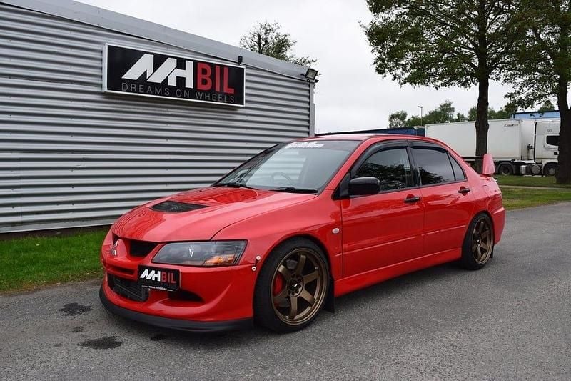 Röd Begagnad 2003 Mitsubishi Lancer Sedan | 299 900 kr - Bild 1/4