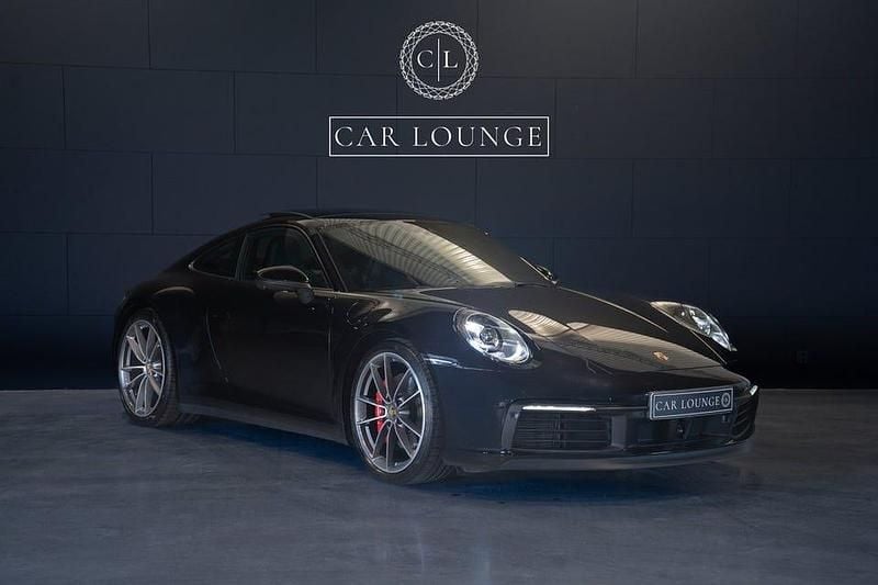 Jet black metallic Begagnad 2020 Porsche 911 Carrera 4S Sportkupé | 1 519 000 kr (Lite dyr) - Bild 1/4