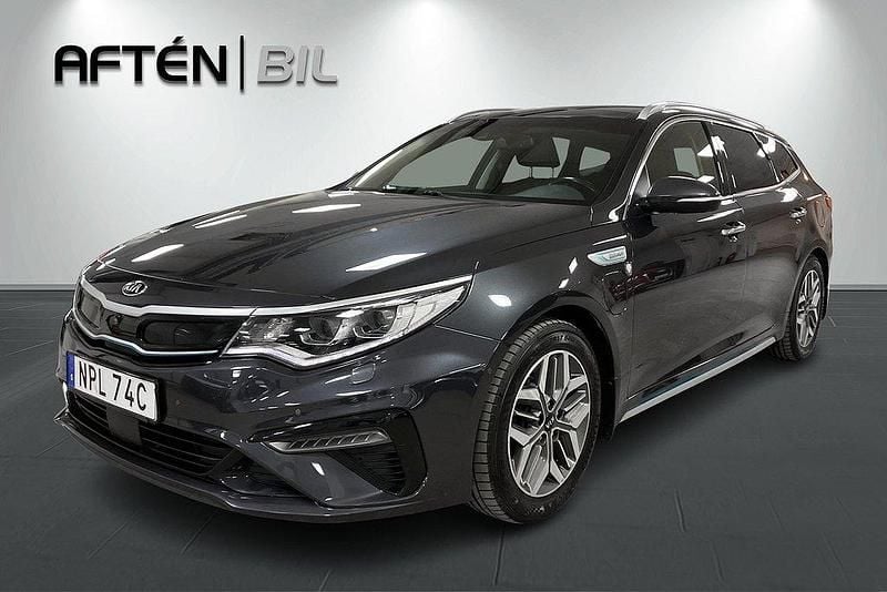 Grå Begagnad 2019 Kia Optima Hybrid 2 Sedan | 179 800 kr (Marknadspris) - Bild 1/3