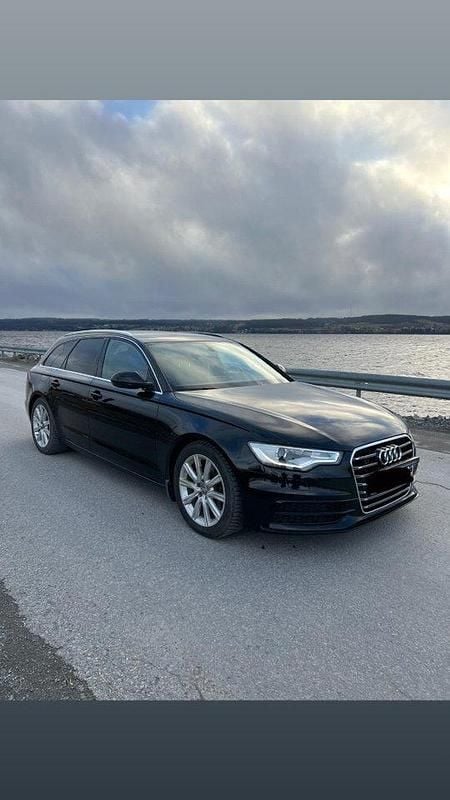 Svart Begagnad 2013 Audi A6 Ambition Kombi | 125 000 kr (Marknadspris) - Bild 1/4