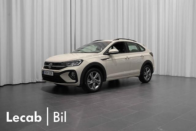 Grå (ascot grey) Begagnad 2022 VW Taigo R-line SUV | 229 500 kr (Marknadspris) - Bild 1/4