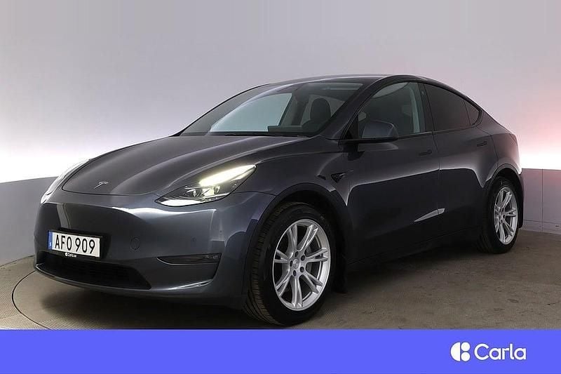 Grå Begagnad 2022 Tesla Model Y Long Range AWD SUV | 387 900 kr (Marknadspris) - Bild 1/4