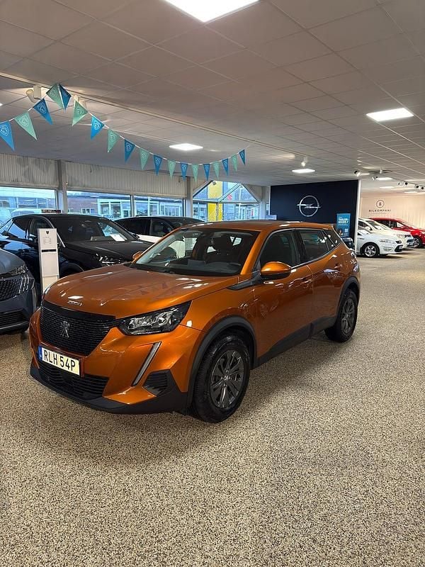 Orange (orange fusion) Begagnad 2021 Peugeot 2008 Active SUV | 194 800 kr (Marknadspris) - Bild 1/4