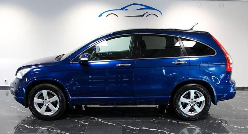 Mörkblå Begagnad 2010 Honda CR-V Executive SUV | 89 800 kr (Marknadspris) - Bild 1/4