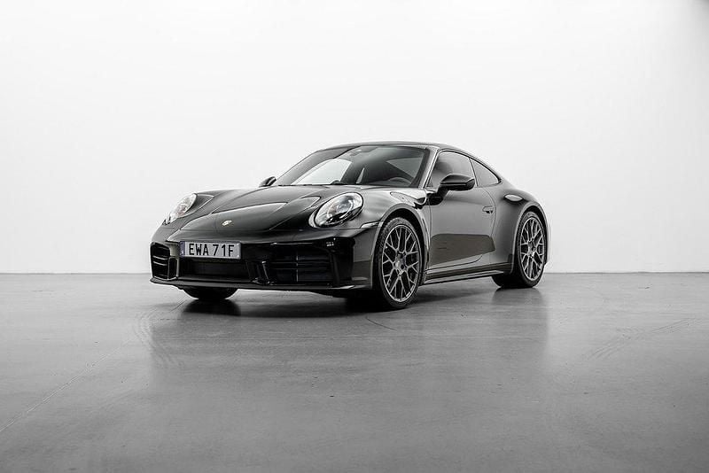 Svart Begagnad 2024 Porsche 911 Carrera Sportkupé | 1 549 000 kr - Bild 1/4