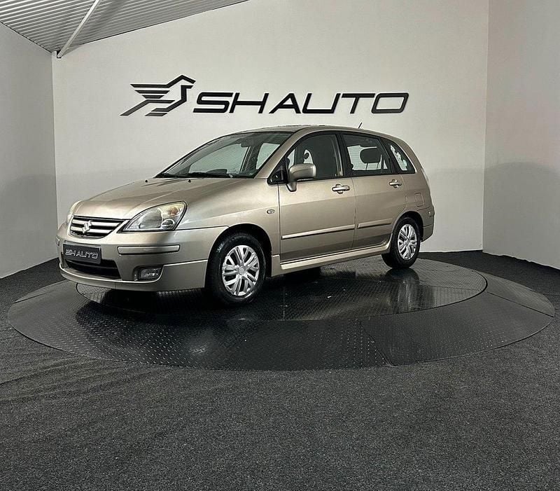 Ljusbrun (brun) Begagnad 2004 Suzuki Liana Halvkombi | 33 900 kr (Marknadspris) - Bild 1/4
