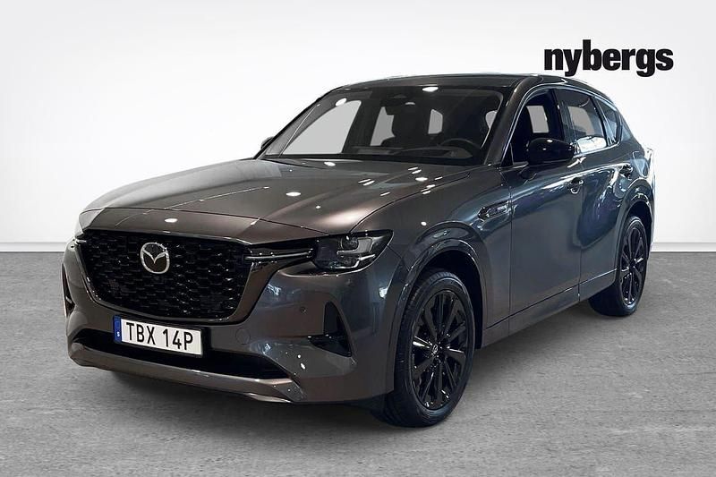Grå Begagnad 2024 Mazda CX-60 Homura-Line SUV | 489 900 kr (Marknadspris) - Bild 1/4