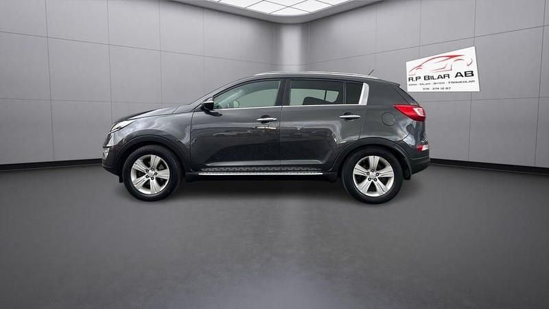 Mörkgrå Begagnad 2012 Kia Sportage Comfort SUV | 94 900 kr (Marknadspris) - Bild 1/4