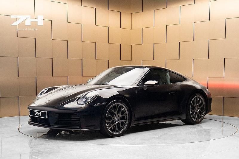 Svart Begagnad 2024 Porsche 911 Carrera Sportkupé | 1 549 000 kr (Bra pris) - Bild 1/4