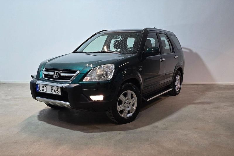 Mörkgrön (grön) Begagnad 2004 Honda CR-V SUV | 109 900 kr - Bild 1/4