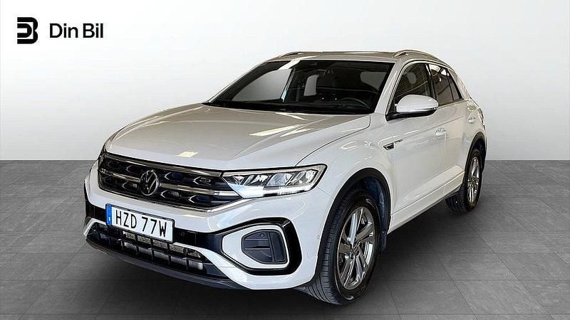 Grå (ascot grey) Begagnad 2022 VW T-Roc R-line SUV | 319 900 kr (Marknadspris) - Bild 1/4