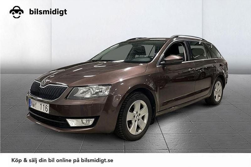 Mörkbrun Begagnad 2013 Skoda Octavia Ambition Kombi | 108 900 kr (Marknadspris) - Bild 1/3