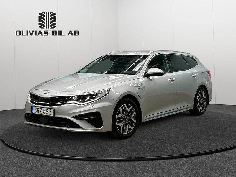 Grå Begagnad 2019 Kia Optima Hybrid Advance Sedan | 198 400 kr (Marknadspris) - Bild 1/4