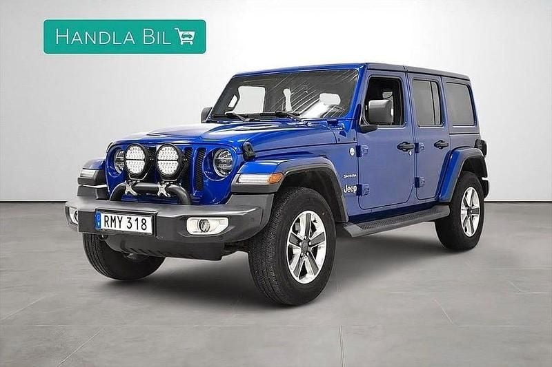 Blå Begagnad 2018 Jeep Wrangler Unlimited Sahara SUV | 374 900 kr - Bild 1/4