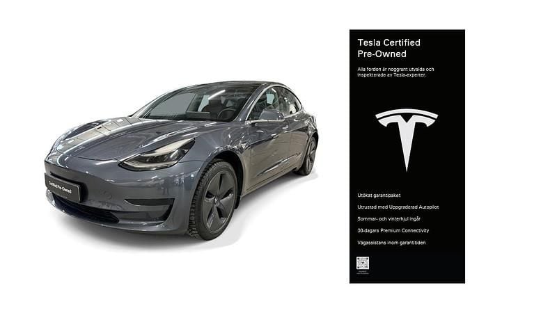 Grå Begagnad 2020 Tesla Model 3 Standard Range Plus Sedan | 231 600 kr (Marknadspris) - Bild 1/4