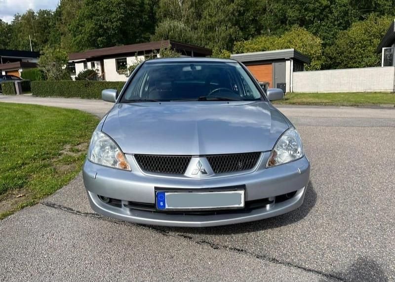 Silver Begagnad 2006 Mitsubishi Lancer Invite Sedan | 39 900 kr (Dyr) - Bild 1/4