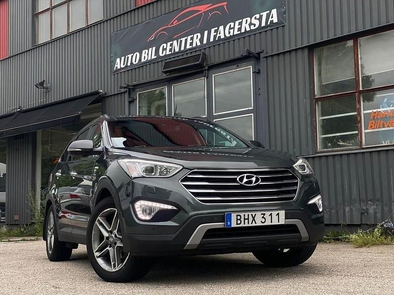Mörkgrön Begagnad 2014 Hyundai Grand Santa Fe Premium SUV | 149 900 kr (Marknadspris) - Bild 1/4