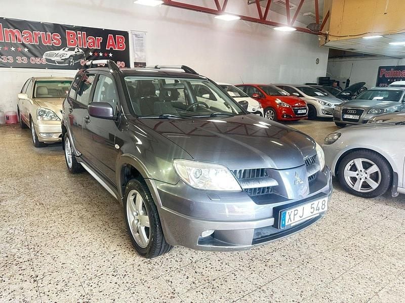 Mörkgrå Begagnad 2006 Mitsubishi Outlander SUV | 39 900 kr (Bra pris) - Bild 1/4