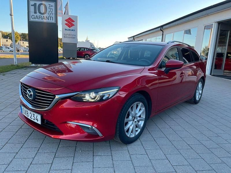 Röd (röd metallic) Begagnad 2015 Mazda 6 Vision Kombi | 124 000 kr (Marknadspris) - Bild 1/4