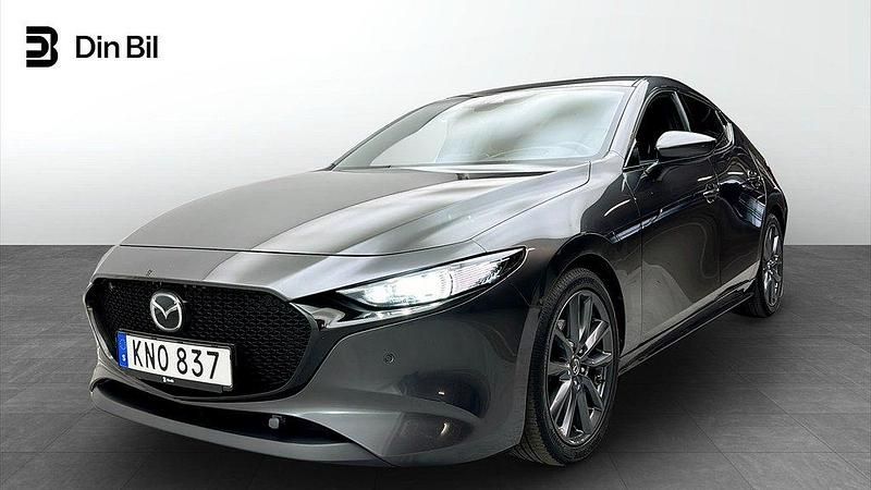 Grå (svart) Begagnad 2019 Mazda 3 Halvkombi | 209 900 kr (Marknadspris) - Bild 1/4