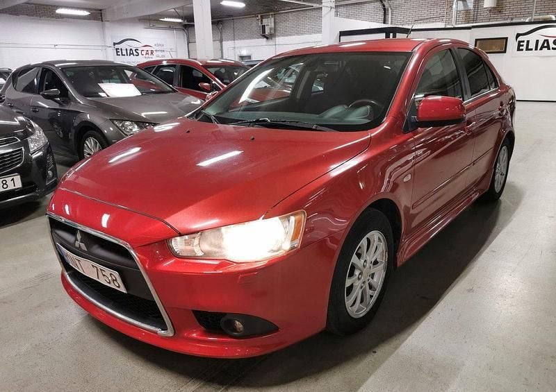 Mörkröd Begagnad 2011 Mitsubishi Lancer Sportback Halvkombi | 44 900 kr (Marknadspris) - Bild 1/4