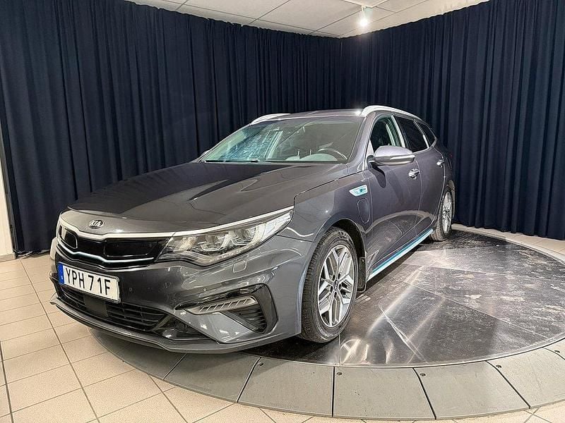Grå metallic Begagnad 2018 Kia Optima Hybrid Advance Sedan | 189 000 kr (Marknadspris) - Bild 1/4