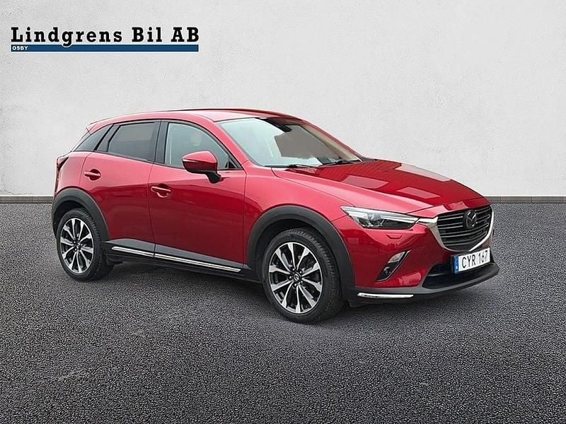 Röd metallic Begagnad 2018 Mazda CX-3 Optimum SUV | 194 900 kr (Marknadspris) - Bild 1/4