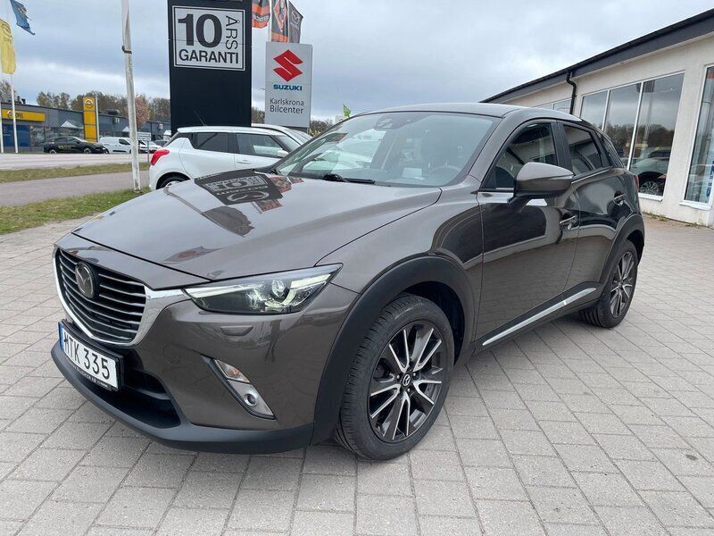Brun (titanium flash metallic) Begagnad 2015 Mazda CX-3 Optimum SUV | 144 000 kr (Marknadspris) - Bild 1/4