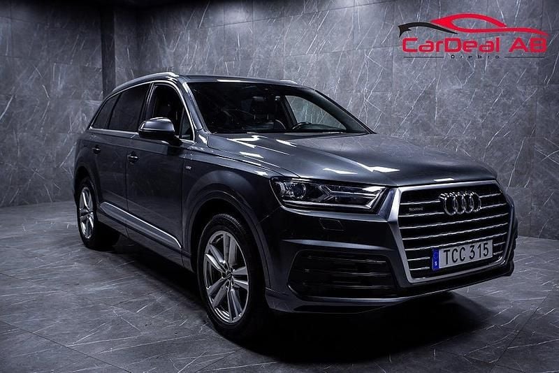 Grå Begagnad 2015 Audi Q7 S-Line SUV | 269 800 kr (Marknadspris) - Bild 1/4