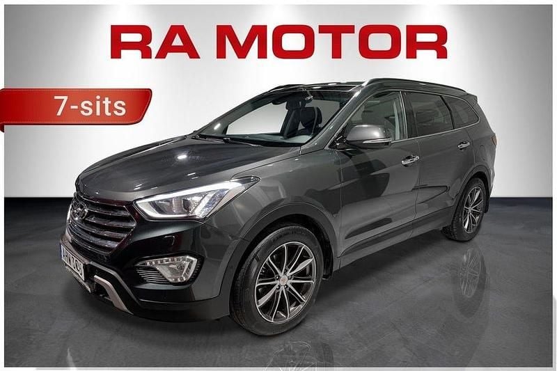 Mörkgrön Begagnad 2014 Hyundai Grand Santa Fe Premium SUV | 119 900 kr (Marknadspris) - Bild 1/4
