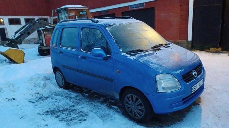 Begagnad Opel Agila 75 HK (55 kW) 2001 Ljusblå med vissa bucklor Minibuss