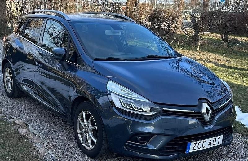 Grå/blå metallic Begagnad 2018 Renault Clio IV Intens Kombi | 94 000 kr (Marknadspris) - Bild 1/4