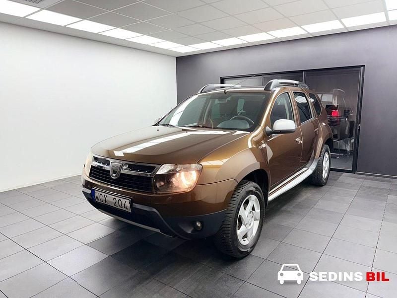 Brun Begagnad 2011 Dacia Duster SUV | 52 900 kr (Marknadspris) - Bild 1/4