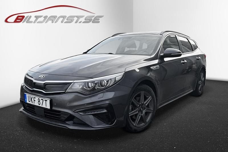Grå Begagnad 2020 Kia Optima Hybrid Sport Sedan | 219 900 kr (Marknadspris) - Bild 1/2