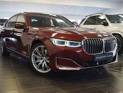 Mörkröd Begagnad 2021 BMW 745e Comfort Edition Sedan | 589 900 kr
