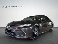 Mörkbrun (brun) Begagnad 2022 Toyota Camry Hybrid Executive Sedan | 339 900 kr (Marknadspris)