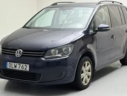 Mörkblå Begagnad 2014 VW Touran Minibuss | 35 000 kr