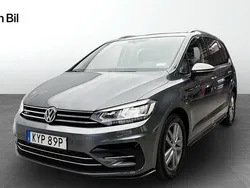 Mörkgrå Begagnad 2019 VW Touran R-line Minibuss | 269 900 kr (Marknadspris)