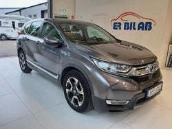 Ljusgrå Begagnad 2019 Honda CR-V Hybrid SUV | 269 900 kr (Marknadspris)