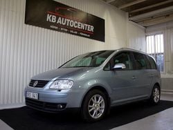 Ljusblå Begagnad 2006 VW Touran Minibuss | 34 900 kr
