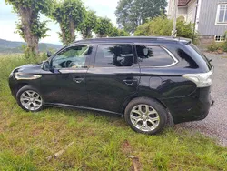 Svart Begagnad 2014 Mitsubishi Outlander P-HEV SUV | 90 000 kr (Marknadspris)