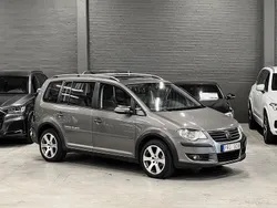 Mörkgrå (grå metallic) Begagnad 2010 VW Touran Cross Minibuss | 94 900 kr (Marknadspris)