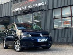Mörkblå Begagnad 2012 VW Touran Minibuss | 94 900 kr (Marknadspris)