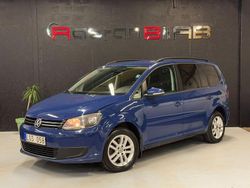 Mörkblå Begagnad 2011 VW Touran Minibuss | 65 000 kr (Lite dyr)