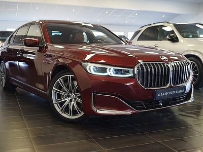 Mörkröd Begagnad 2021 BMW 745e Comfort Edition Sedan | 589 900 kr